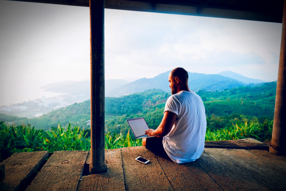 Remote work setup with a view of African landscape.